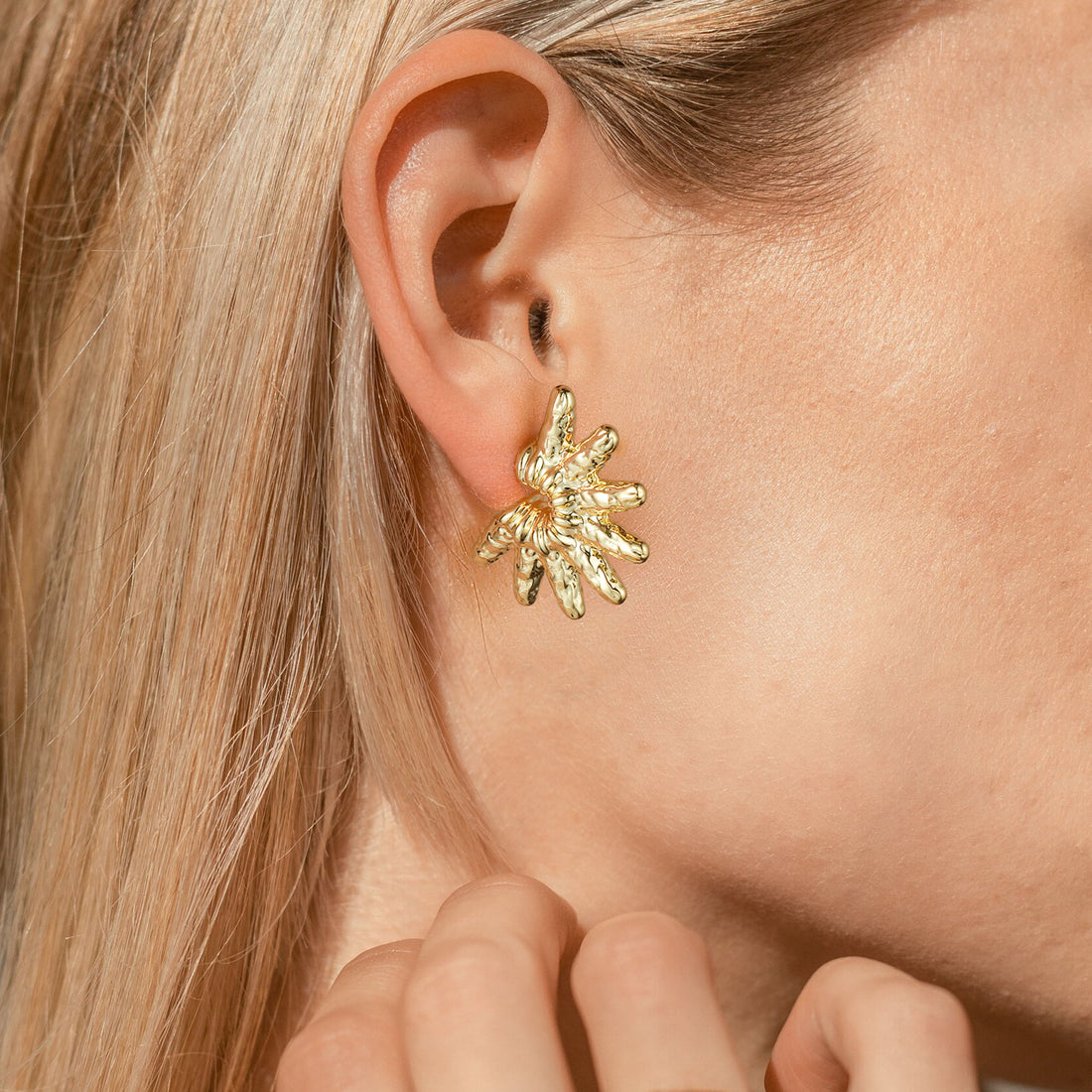 Golden, snowflake-shaped earrings
