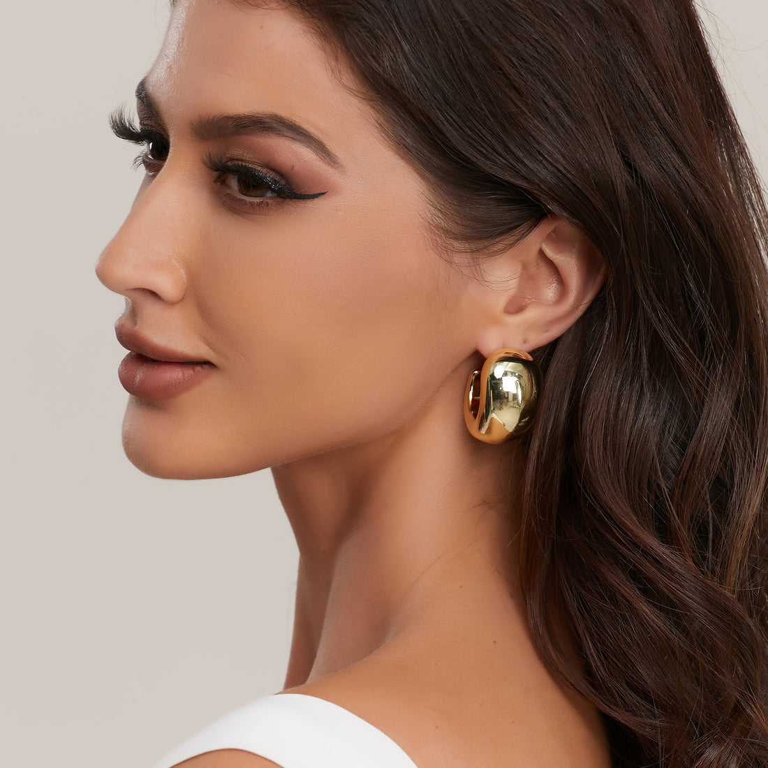 Golden, female pendant earrings