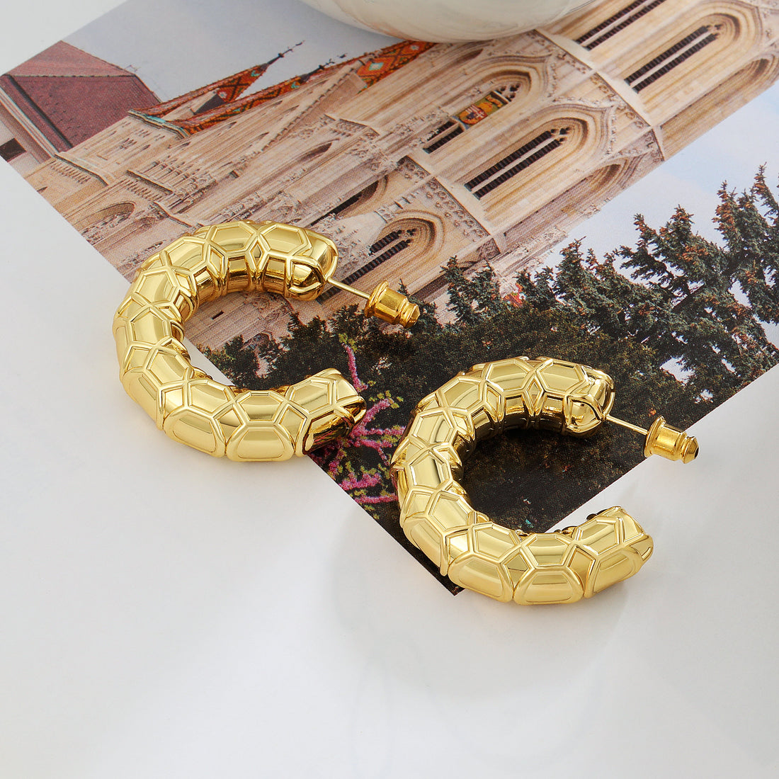 Golden, small C-shaped hoop earrings