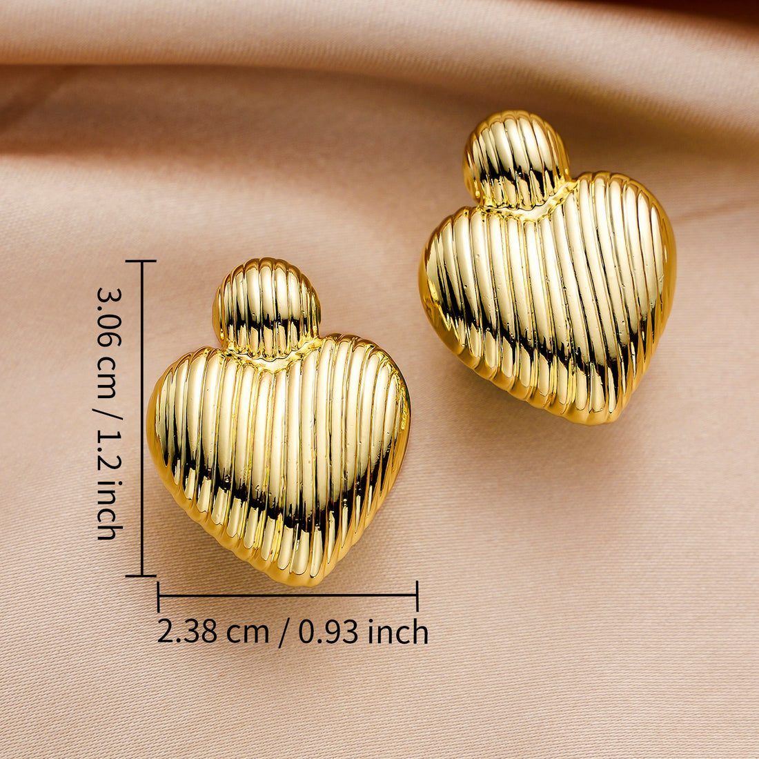 Gold-colored, a pair of heart-shaped earrings, one large and one small